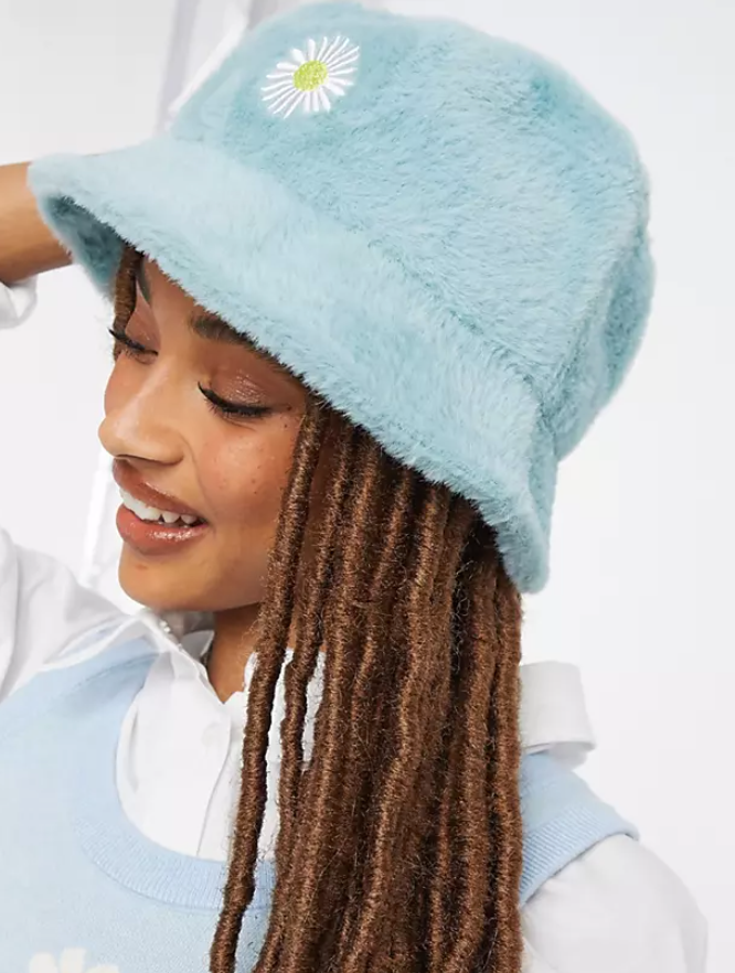 8 Fuzzy Bucket Hats to Shop and Style Like Rihanna, Rosalía, Megan